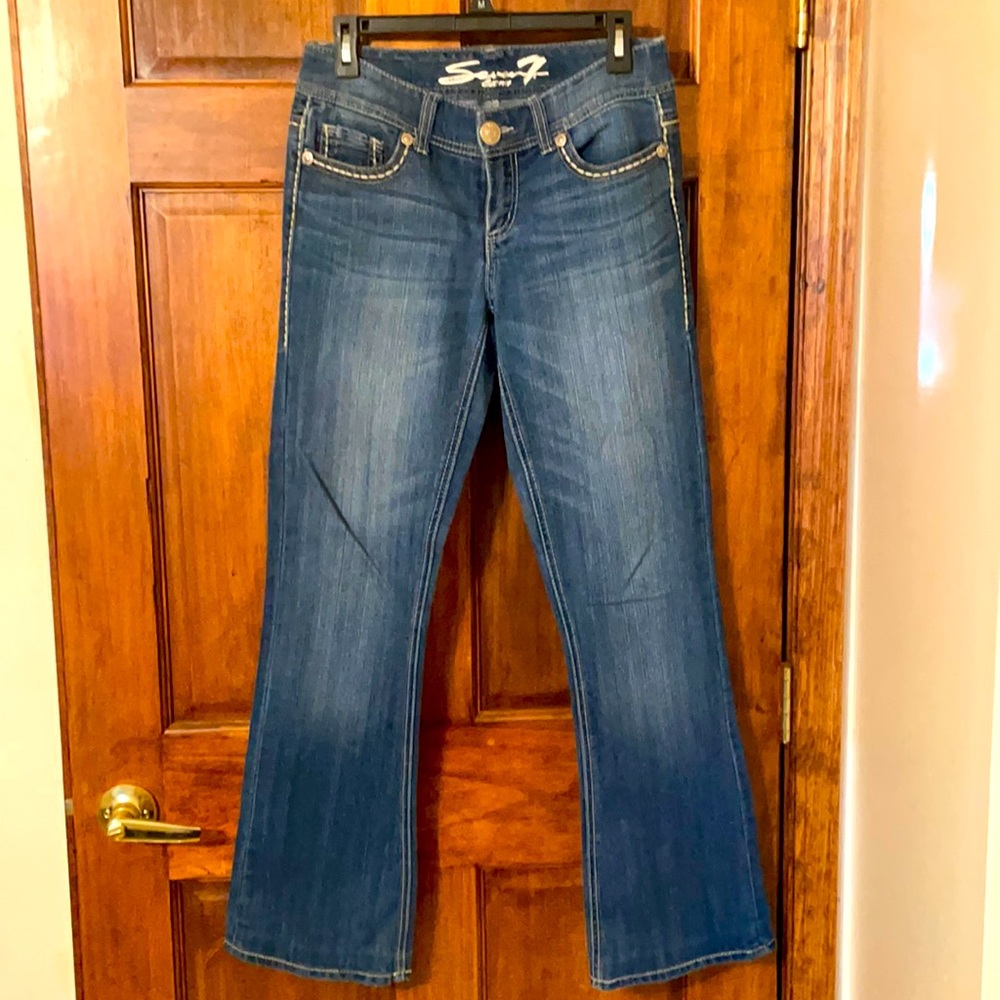 Size 28- medium blue, boot cut, 7 jeans.